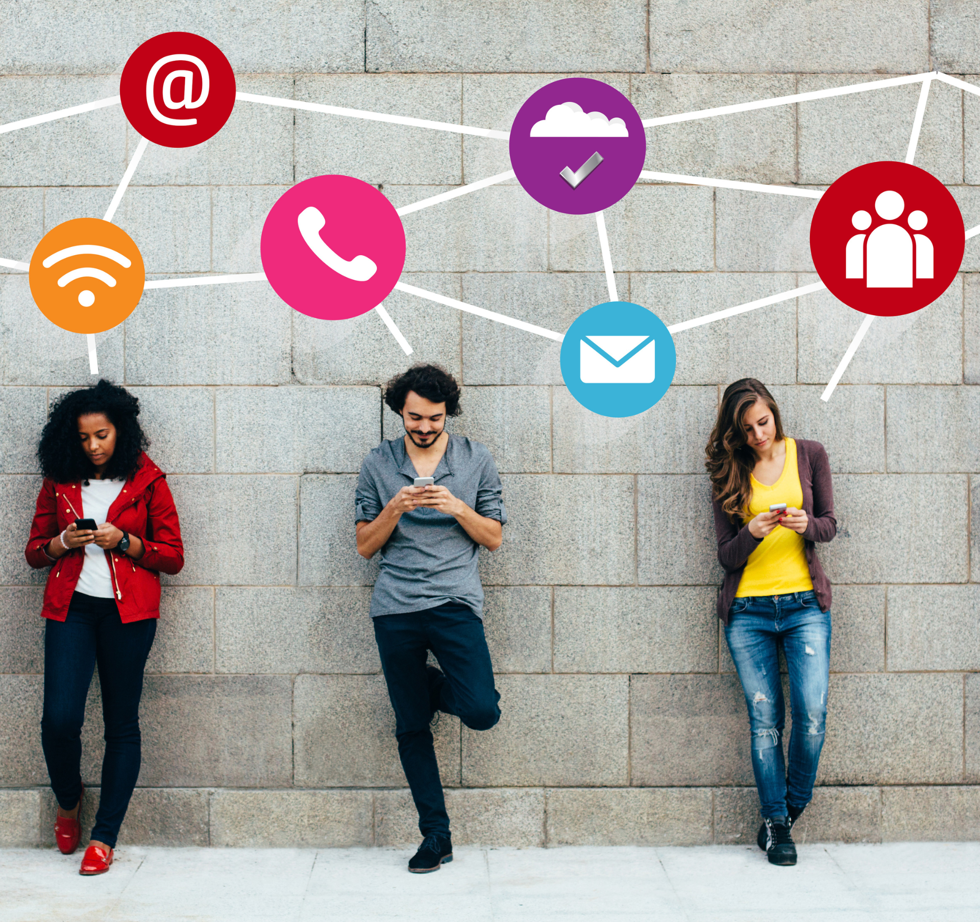 Three people leaning against a wall all looking at their phones using social media