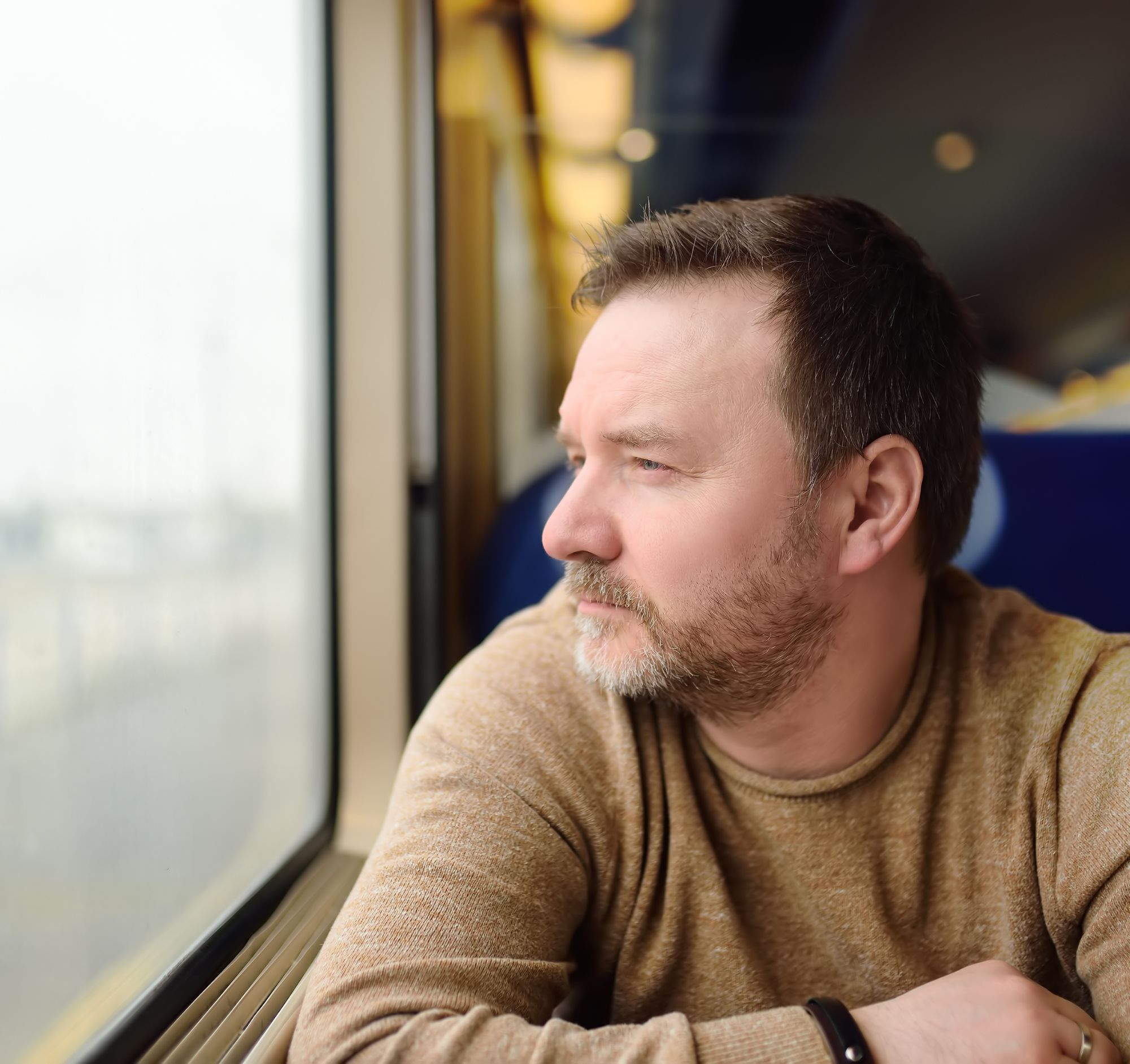 A man starting out of the window